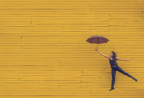 woman, floating, umbrella, yellow, happy, smile
